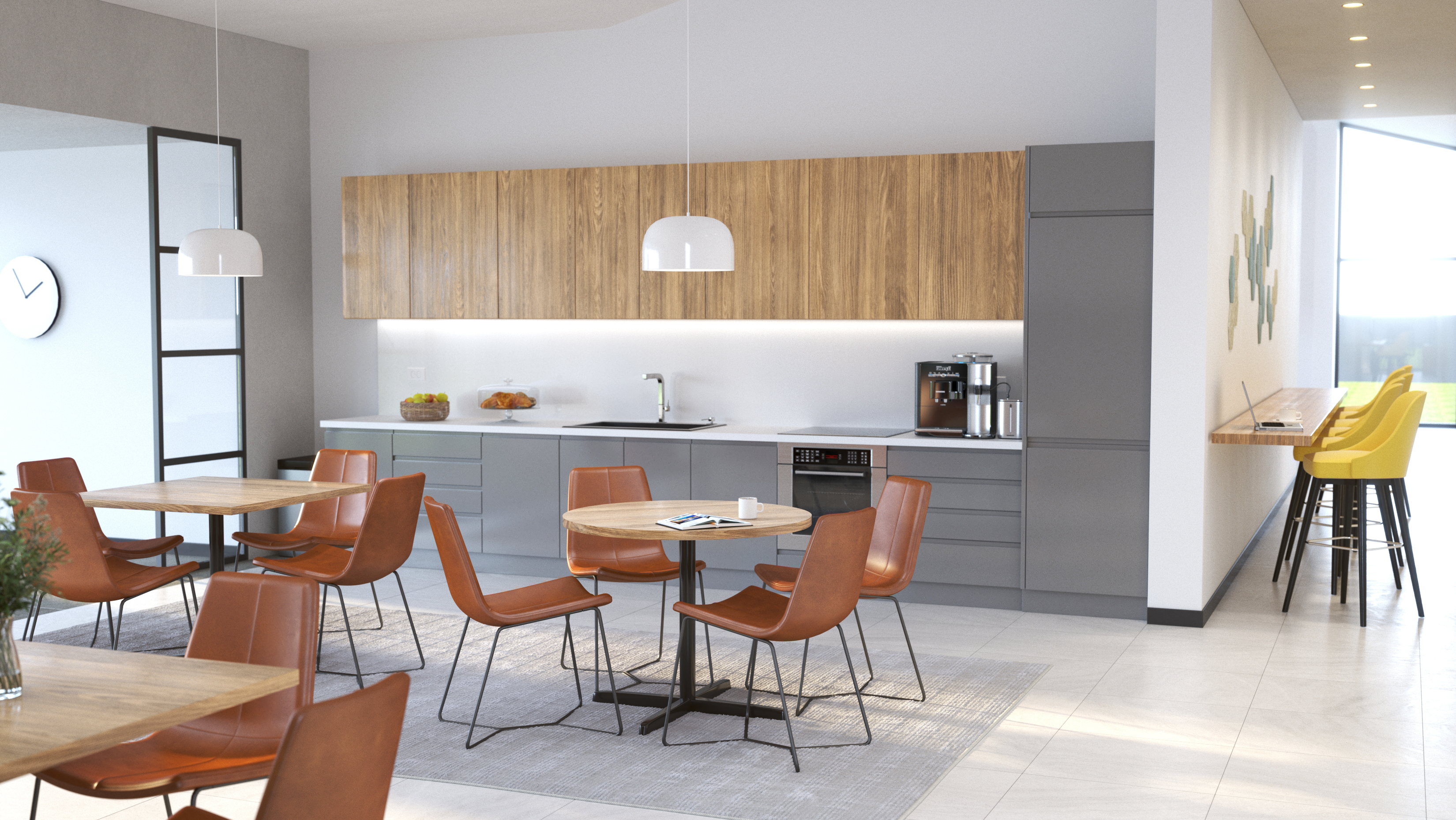 Break room with grey base cabinets and walnut upper cabinets, stainless sink; round tables with brown leather chairs; yellow bar stools by window.