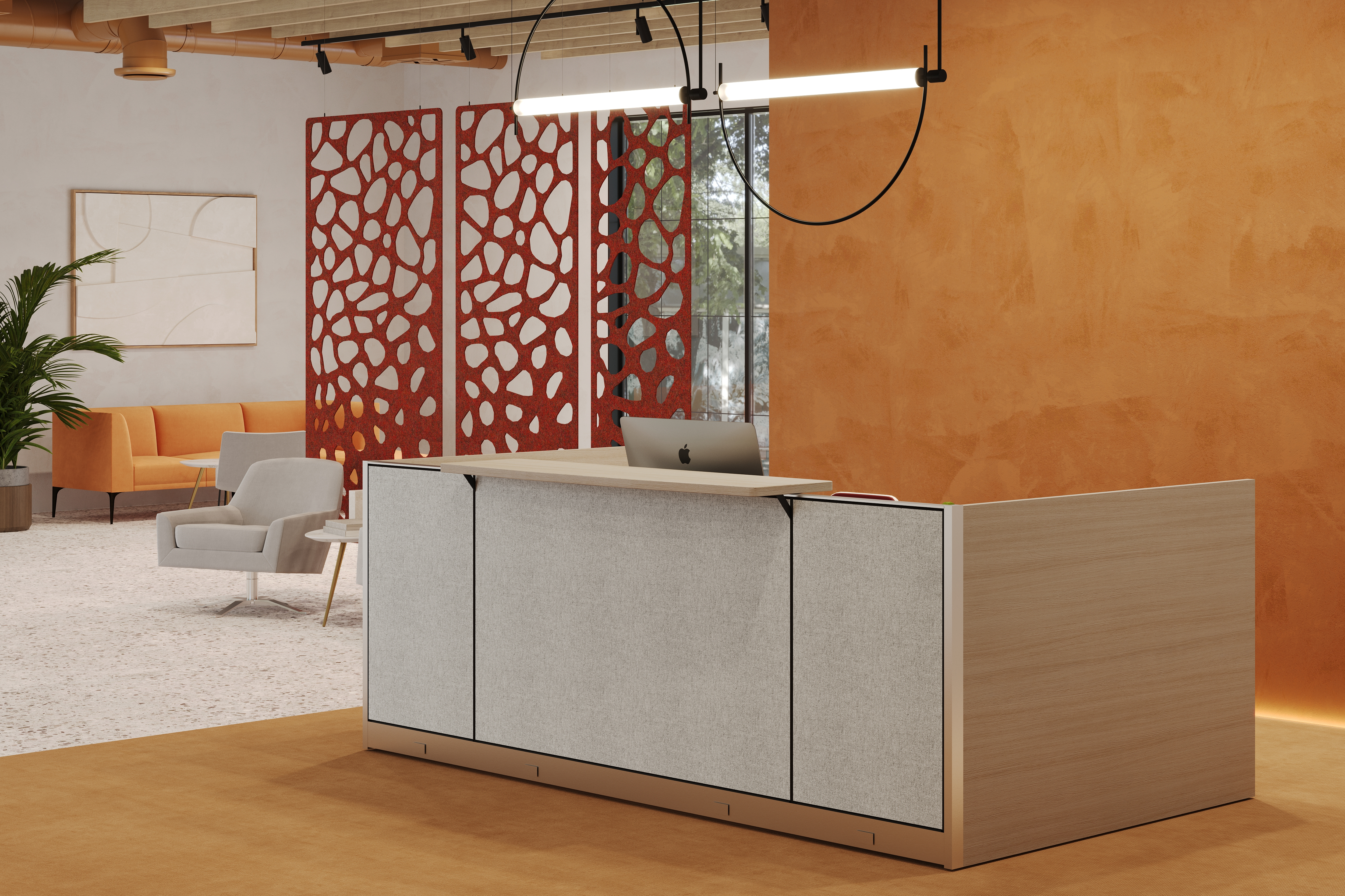 Modern showroom reception desk with laptop; orange textured wall, red perforated divider, and lounge area with orange sofa and gray lounge chairs.