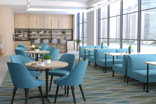 West Elm Work Sterling seating in a large workplace cafÃ©