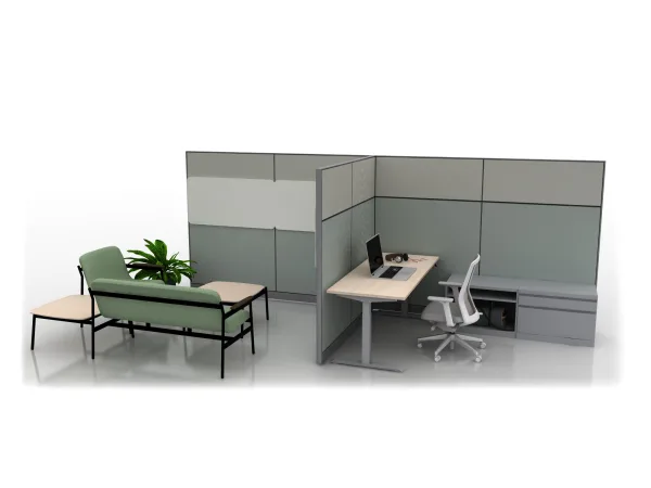 Partitioned office cubicle with light wood desk and white ergonomic chair; laptop and headphones; gray fabric panels; adjacent mint-green lounge with sofa.AMQ_Work-Hub-003-2.jpeg